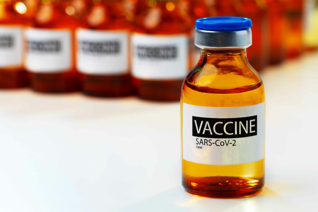 sars cov 2 vaccine vial bottles on white table