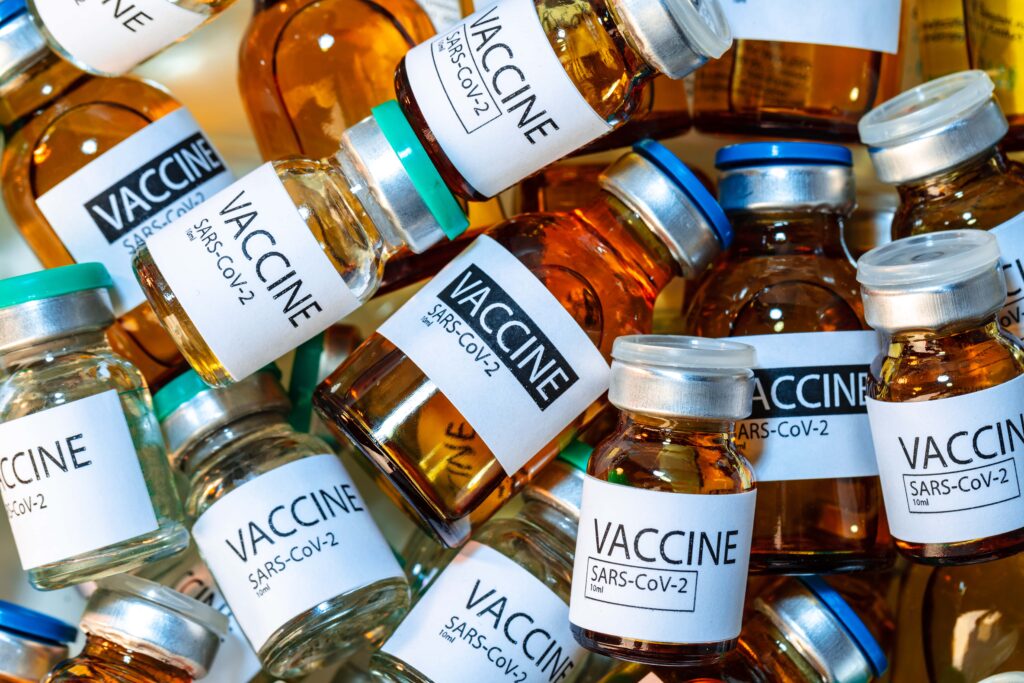 vaccine-vials-of-sars-cov-2-on-table-in-laboratory-min