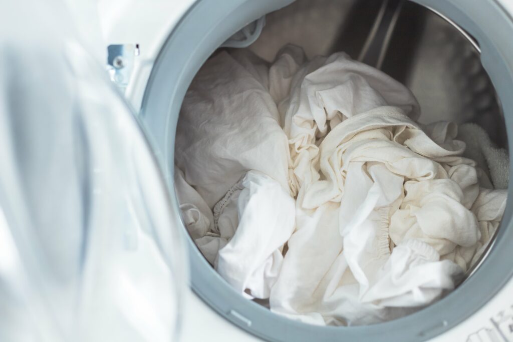 white clothes in washing machine open door