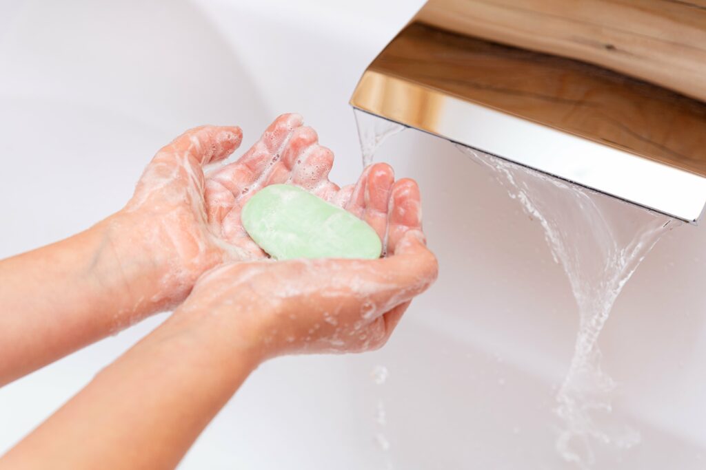 the-child-washes-his-hands-with-soap-under-a-tap
