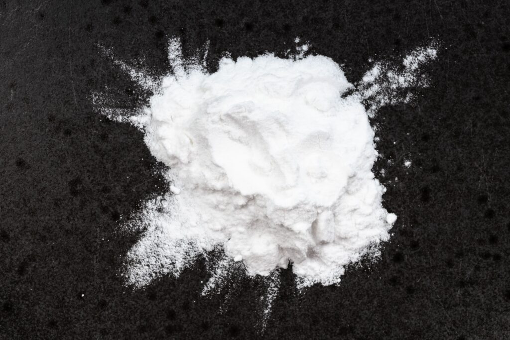 top-view-of-pile-of-potato-starch-closeup-on-black
